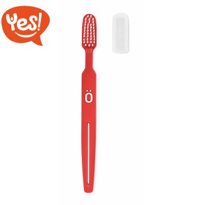 Spazzolino da denti con tappo e spremi-tubetto